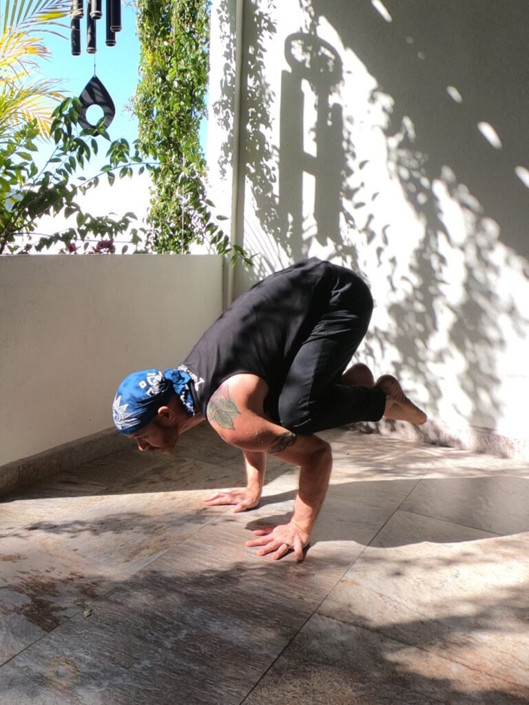 Crow Pose (Kakasana) being performed by Jai Salsbery at the Vallarta Breeze Yoga Puerto Vallarta Yoga Studio.